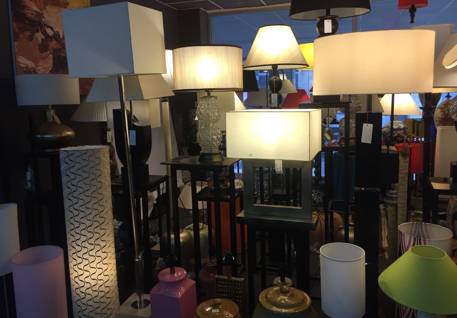 Cluster of floor lamps grouped together in the showroom