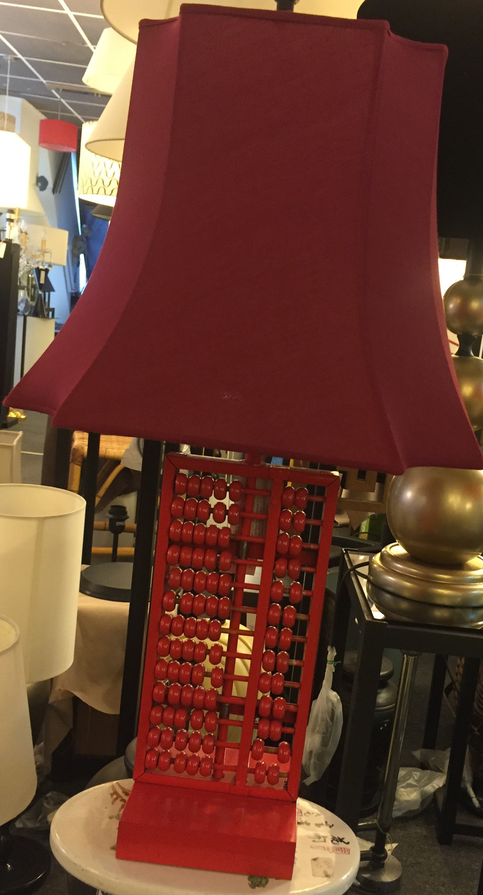 Table lamp with a hand-painted red abacus base and matching red shade