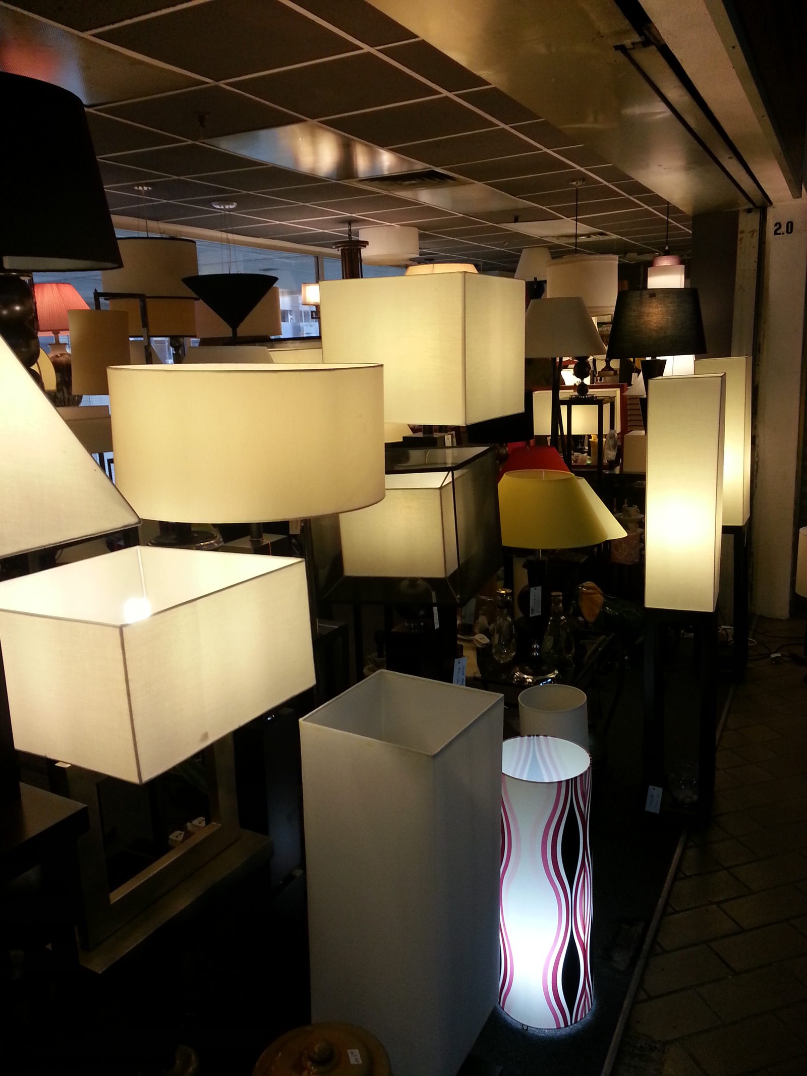 Wide view of the Citizone showroom with dozens of lamps on display